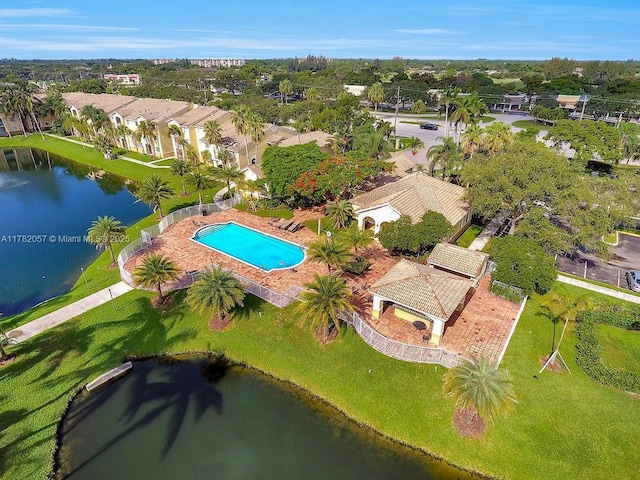 drone / aerial view featuring a residential view and a water view