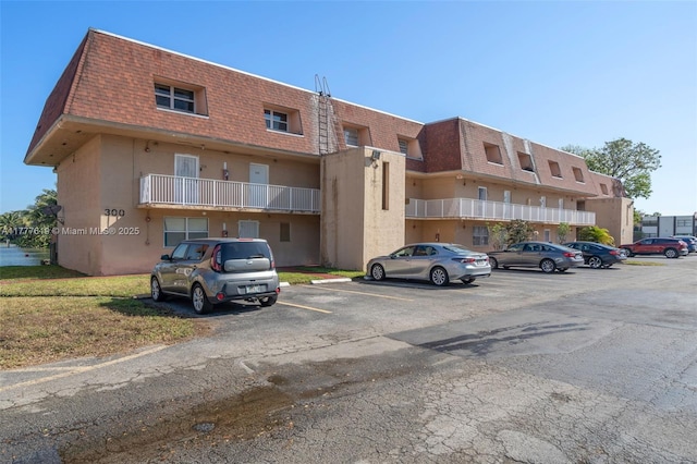 300 NW 107th Ave Unit 201, Miami, FL 33172 - view of property featuring uncovered parking