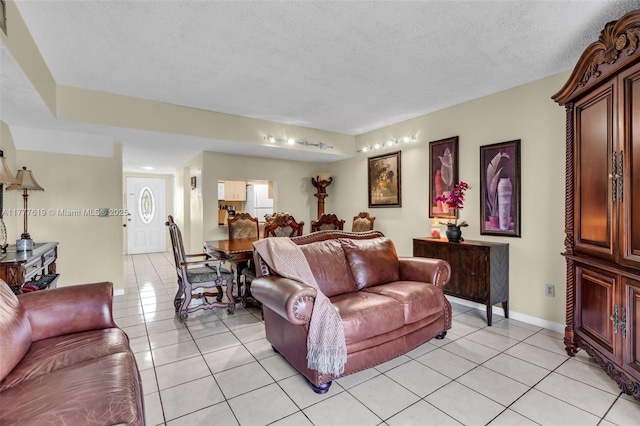 300 NW 107th Ave Unit 201, Miami, FL 33172 - living room featuring a textured ceiling, baseboards, and light tile patterned flooring