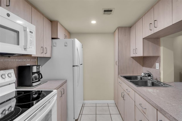 300 NW 107th Ave Unit 201, Miami, FL 33172 - kitchen with light tile patterned floors, white appliances, visible vents, light countertops, and a sink