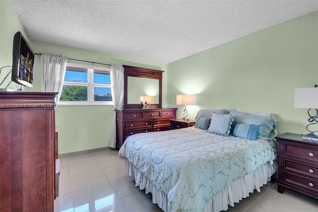 300 NW 107th Ave Unit 201, Miami, FL 33172 - tiled bedroom with a textured ceiling and baseboards