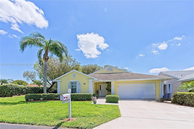 ranch-style home featuring driveway, a front lawn, a garage, and stucco siding