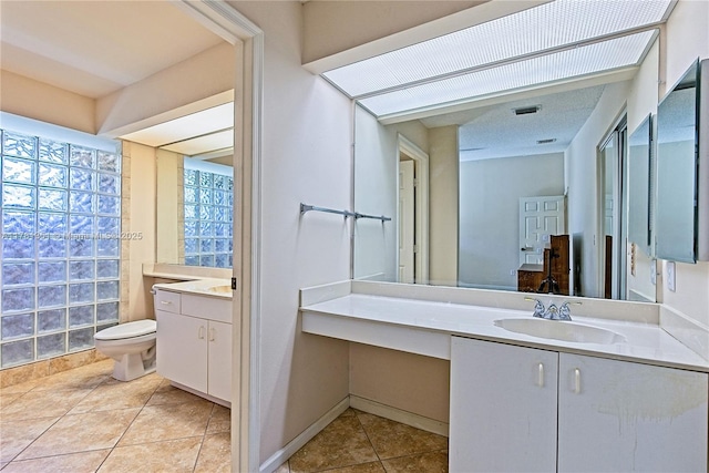 full bath with tile patterned floors, vanity, and toilet