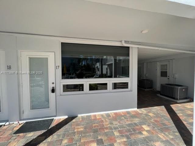 4228 N Ocean Dr Unit 17, Lauderdale By The Sea, FL 33308 - view of exterior entry with central AC unit