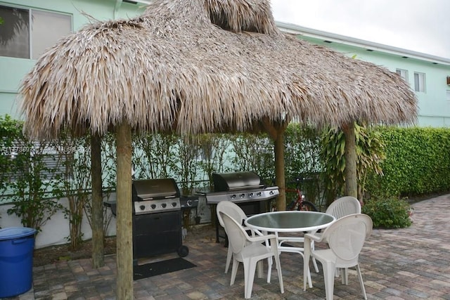 4228 N Ocean Dr Unit 17, Lauderdale By The Sea, FL 33308 - view of patio featuring outdoor dining area and grilling area