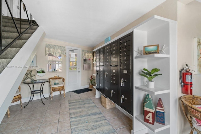 4228 N Ocean Dr Unit 17, Lauderdale By The Sea, FL 33308 - foyer with baseboards, stairway, tile patterned floors, and mail area
