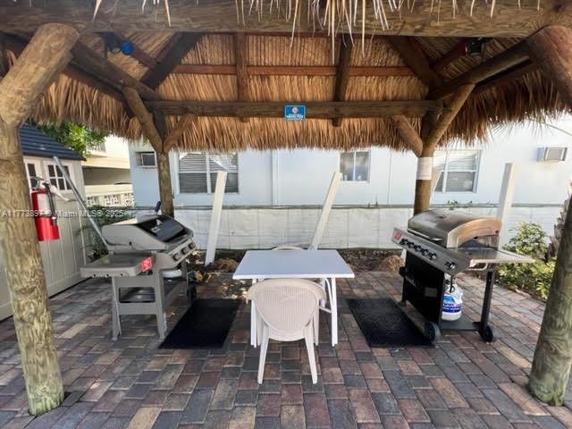 4228 N Ocean Dr Unit 17, Lauderdale By The Sea, FL 33308 - view of patio / terrace featuring a gazebo and grilling area