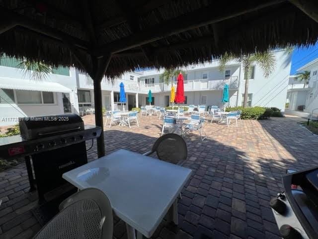 4228 N Ocean Dr Unit 17, Lauderdale By The Sea, FL 33308 - view of patio / terrace with a gazebo and outdoor dining area