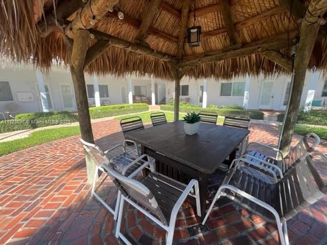 4228 N Ocean Dr Unit 17, Lauderdale By The Sea, FL 33308 - view of patio with outdoor dining area and a gazebo