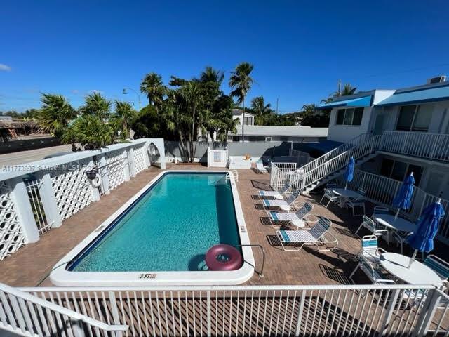 4228 N Ocean Dr Unit 17, Lauderdale By The Sea, FL 33308 - pool featuring a patio area and fence