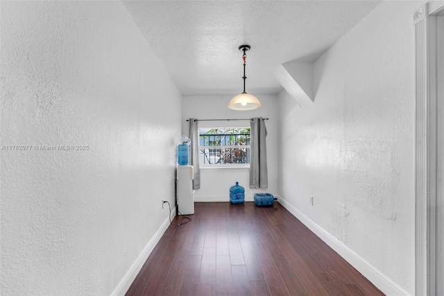 425 NW 8th Ave, Homestead, FL 33030 - spare room featuring a textured wall, baseboards, a textured ceiling, and hardwood / wood-style floors