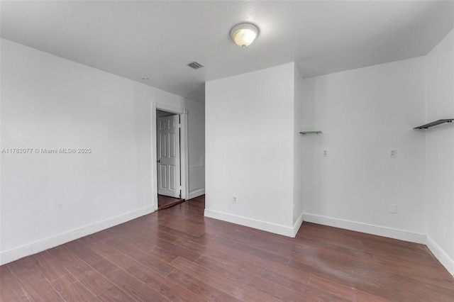 425 NW 8th Ave, Homestead, FL 33030 - spare room with visible vents, baseboards, and wood finished floors