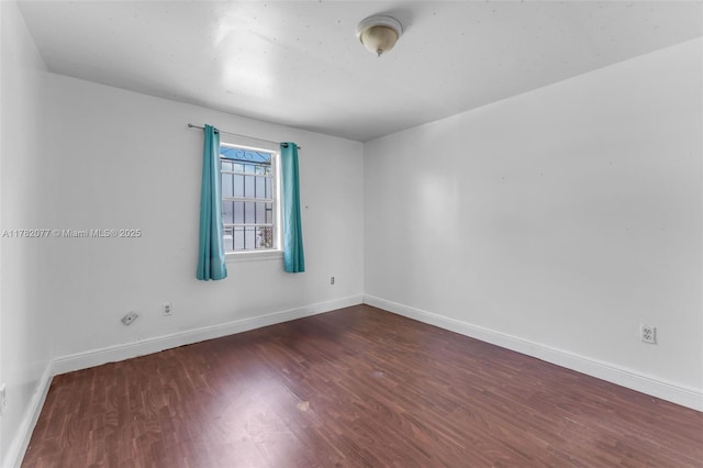 425 NW 8th Ave, Homestead, FL 33030 - empty room with wood finished floors and baseboards