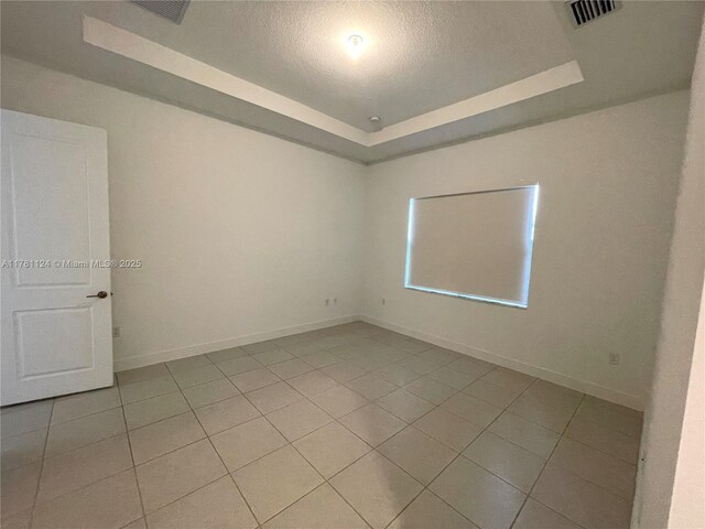 4506 SW 174th Ave, Miramar, FL 33029 - empty room featuring a tray ceiling, baseboards, and visible vents