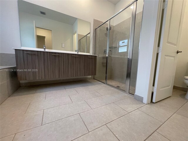 4506 SW 174th Ave, Miramar, FL 33029 - bathroom featuring toilet, a stall shower, tile patterned flooring, and visible vents