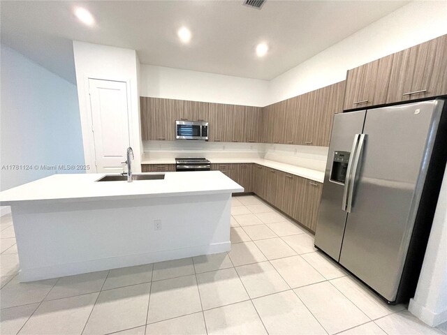 4506 SW 174th Ave, Miramar, FL 33029 - kitchen featuring a sink, light countertops, appliances with stainless steel finishes, and modern cabinets