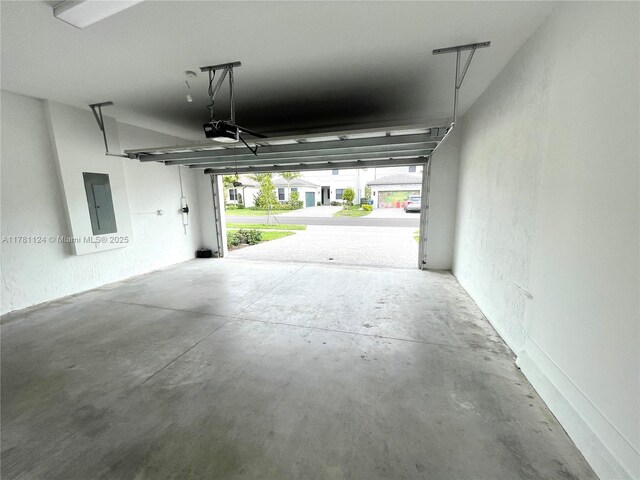 4506 SW 174th Ave, Miramar, FL 33029 - garage featuring electric panel and a garage door opener