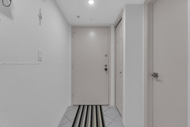 hallway featuring light tile patterned floors
