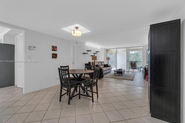 dining room featuring light tile patterned flooring