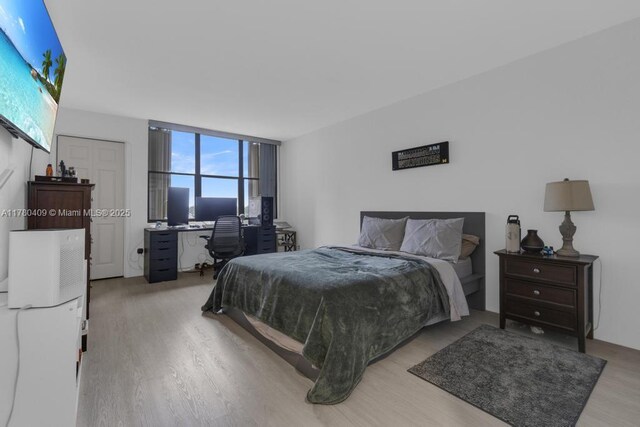 bedroom with light wood-style floors