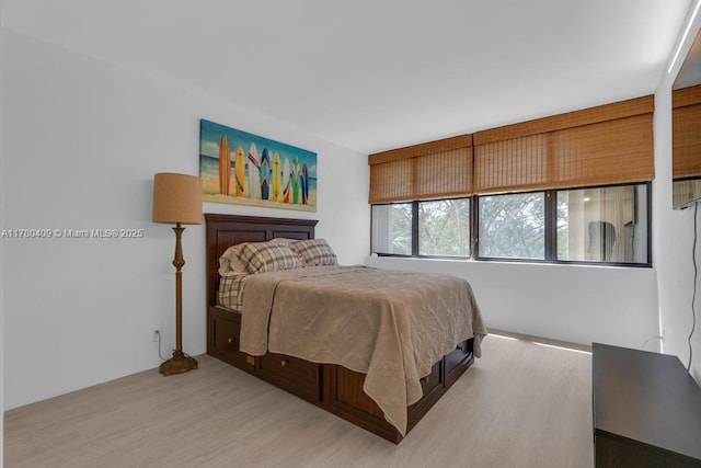 bedroom with light wood-style floors