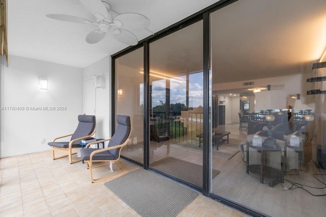 view of patio / terrace with a ceiling fan and visible vents