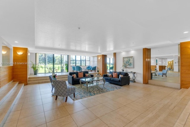 living room with light tile patterned floors and recessed lighting
