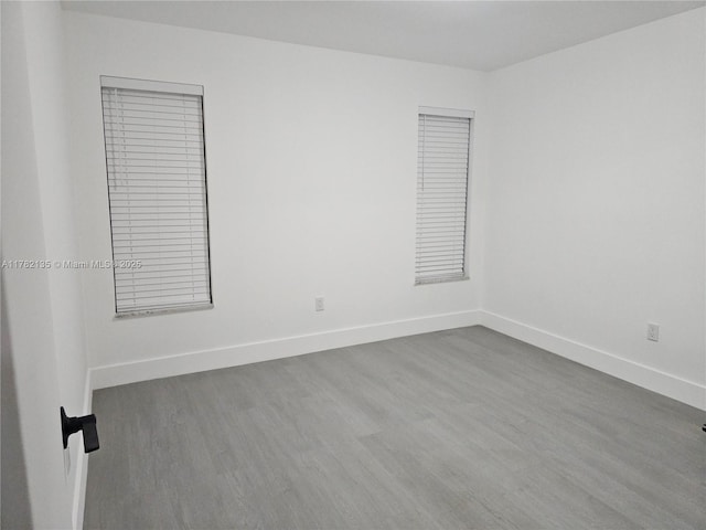 2800 NW 56th Ave Unit B101, Lauderhill, FL 33313 - unfurnished room featuring wood finished floors and baseboards