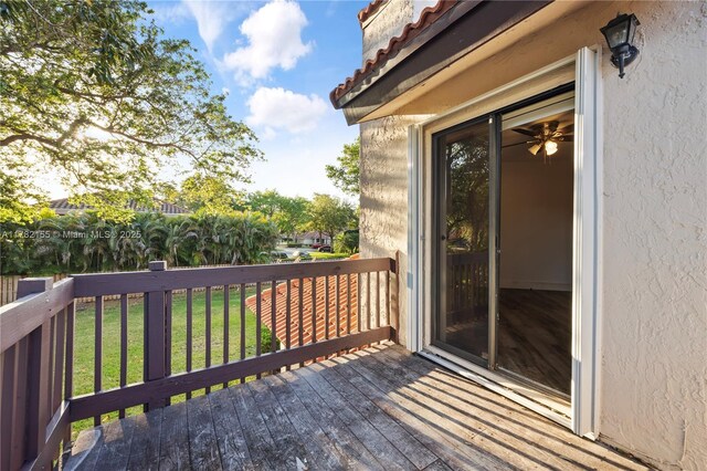9239 W Sunrise Blvd, Plantation, FL 33322 - wooden terrace featuring a lawn