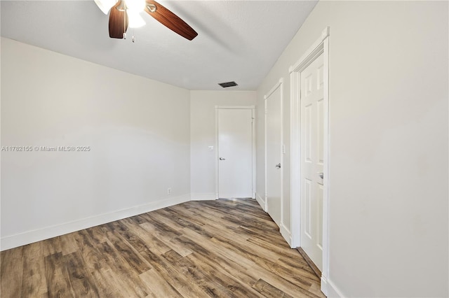9239 W Sunrise Blvd, Plantation, FL 33322 - unfurnished bedroom featuring visible vents, baseboards, ceiling fan, and wood finished floors