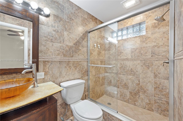 9239 W Sunrise Blvd, Plantation, FL 33322 - bathroom with a shower stall, vanity, tile walls, and toilet
