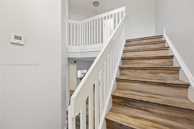 9239 W Sunrise Blvd, Plantation, FL 33322 - stairway featuring wood finished floors