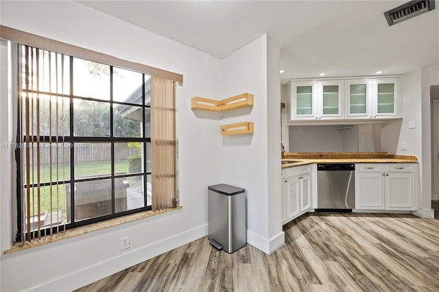 9239 W Sunrise Blvd, Plantation, FL 33322 - kitchen featuring baseboards, light wood-type flooring, white cabinets, visible vents, and dishwasher