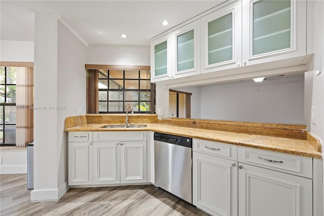 9239 W Sunrise Blvd, Plantation, FL 33322 - kitchen with glass insert cabinets, white cabinets, light wood-style floors, dishwasher, and a sink