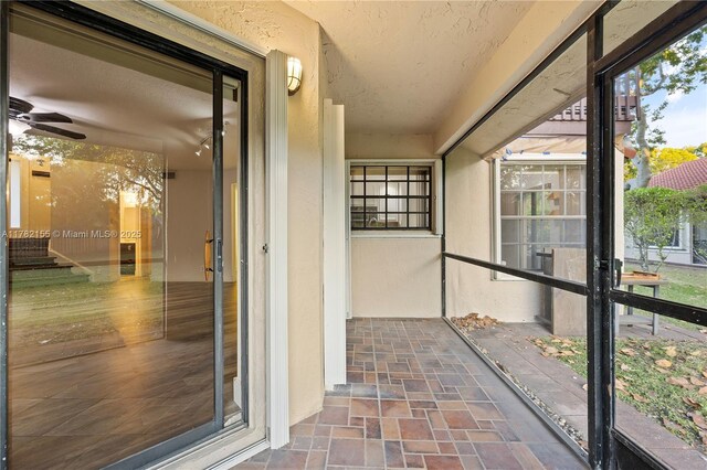 9239 W Sunrise Blvd, Plantation, FL 33322 - unfurnished sunroom featuring a ceiling fan