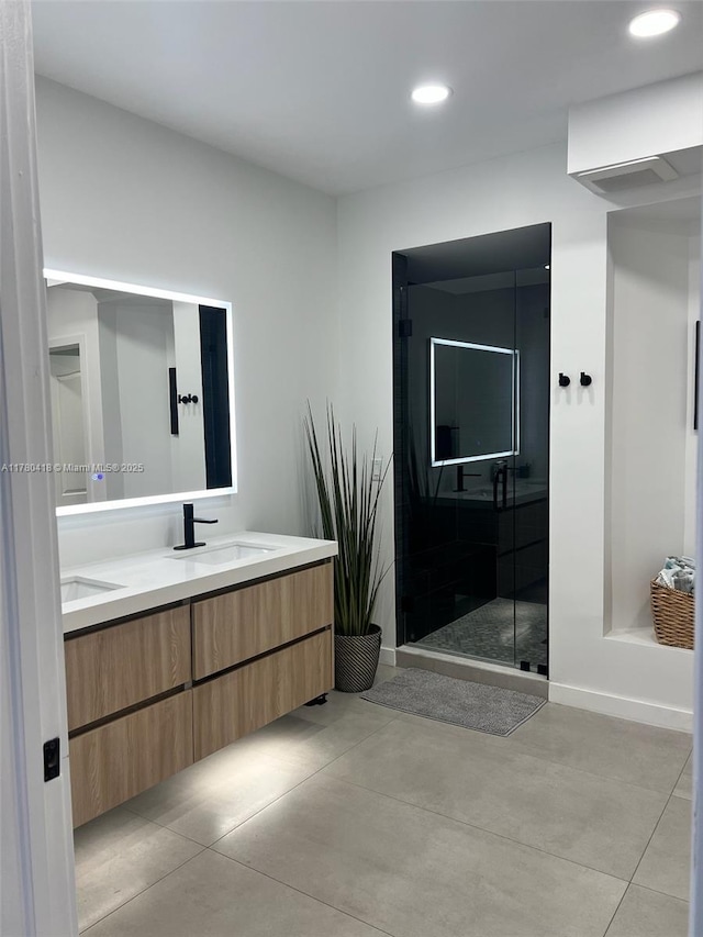 10770 NW 66th St Unit 203, Doral, FL 33178 - bathroom with double vanity, a shower stall, recessed lighting, and concrete floors