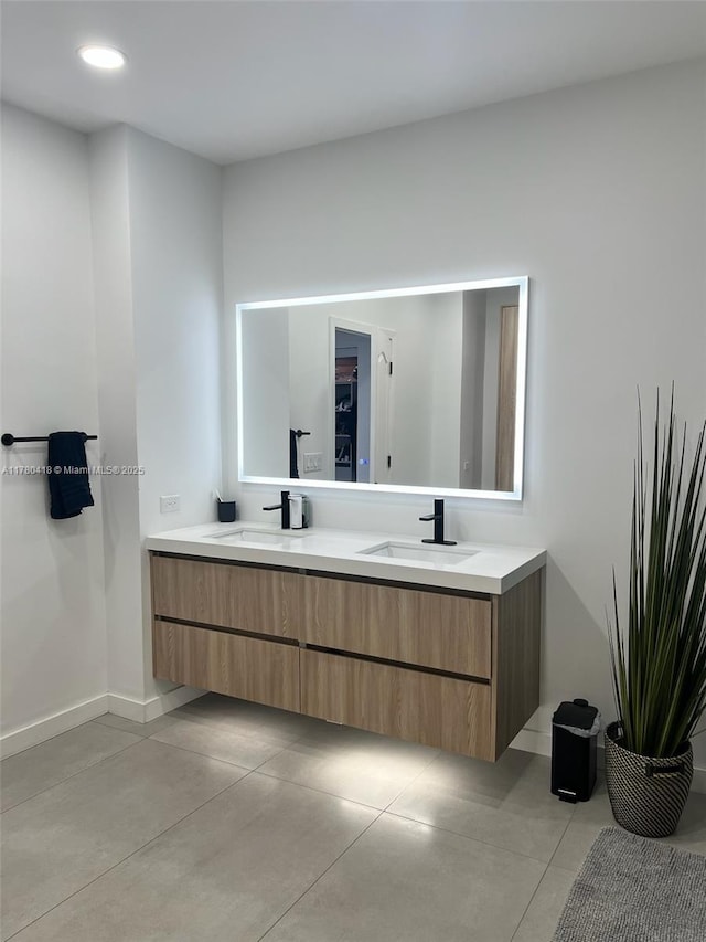 10770 NW 66th St Unit 203, Doral, FL 33178 - bathroom featuring double vanity, baseboards, finished concrete floors, and recessed lighting