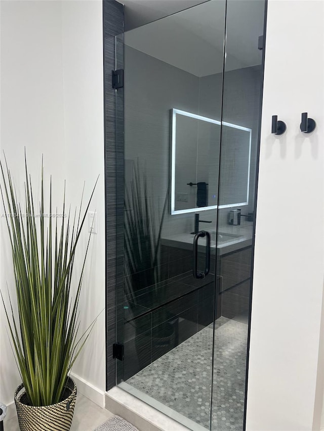 bathroom featuring a shower stall