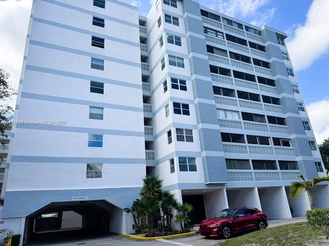 3301 Spanish Moss Ter Unit X, Lauderhill, FL 33319 - view of apartment building / complex with covered parking