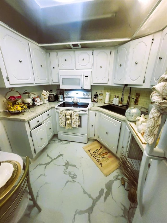 3301 Spanish Moss Ter Unit X, Lauderhill, FL 33319 - kitchen with white appliances, light marble finish floors, white cabinetry, and decorative backsplash