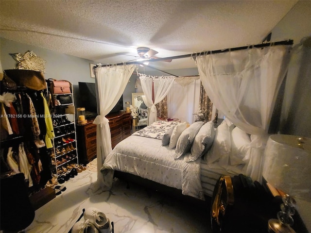 3301 Spanish Moss Ter Unit X, Lauderhill, FL 33319 - bedroom with a textured ceiling, marble look tiles, and ceiling fan