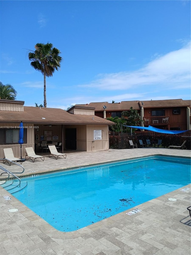 pool featuring a patio and fence