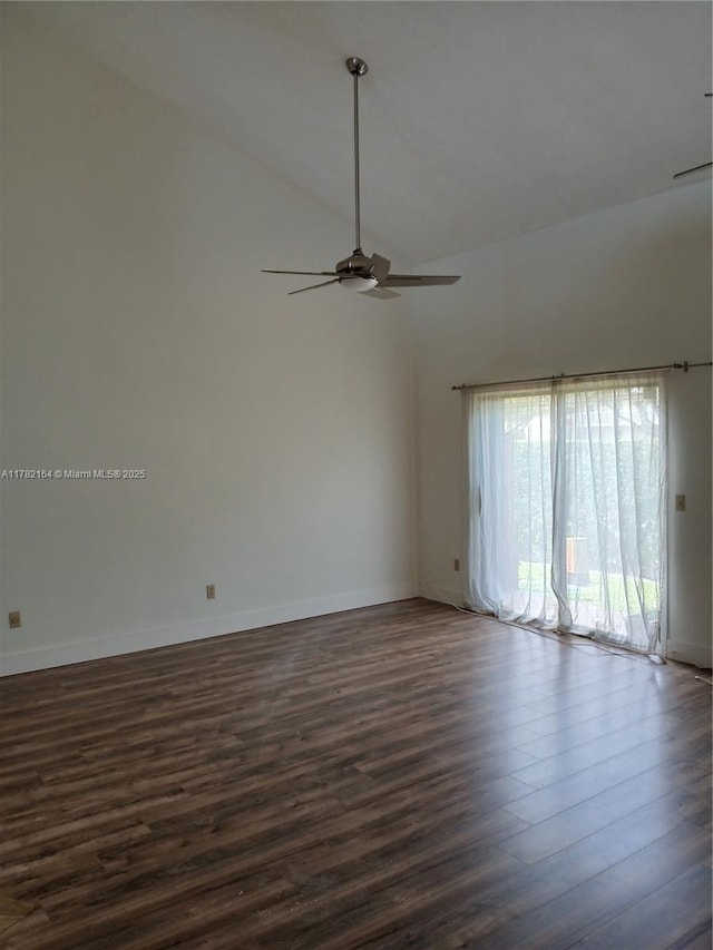 empty room featuring high vaulted ceiling, ceiling fan, baseboards, and dark wood-style floors