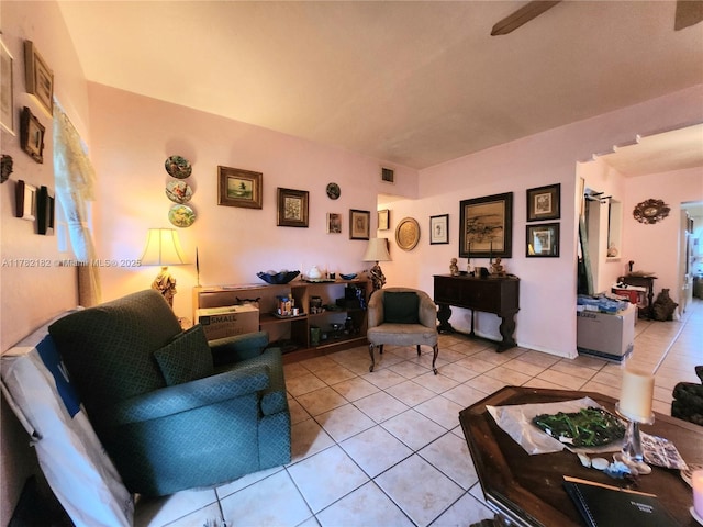 living room with light tile patterned floors and visible vents