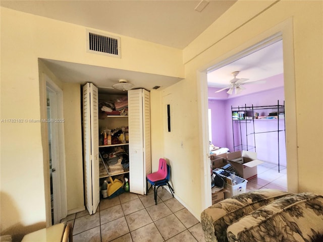interior space with light tile patterned flooring and visible vents