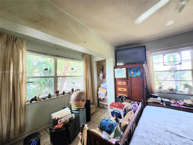 bedroom with light tile patterned flooring