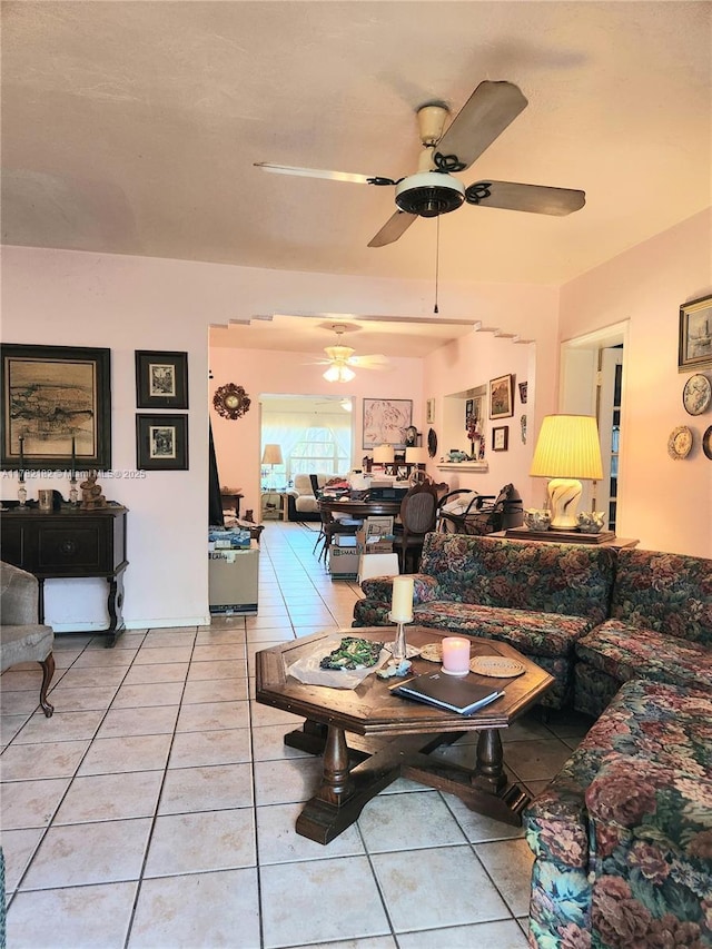 living room with light tile patterned flooring and ceiling fan