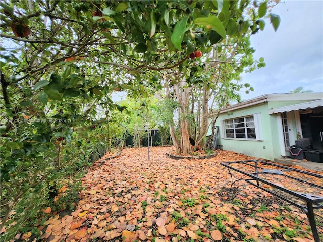 view of yard featuring a patio and fence