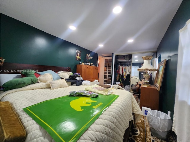 bedroom featuring recessed lighting and vaulted ceiling