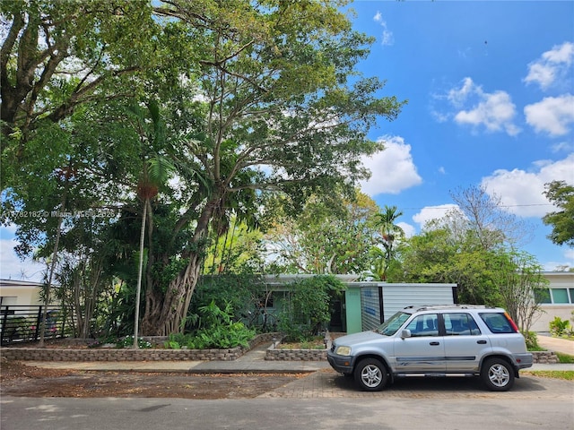 view of property hidden behind natural elements